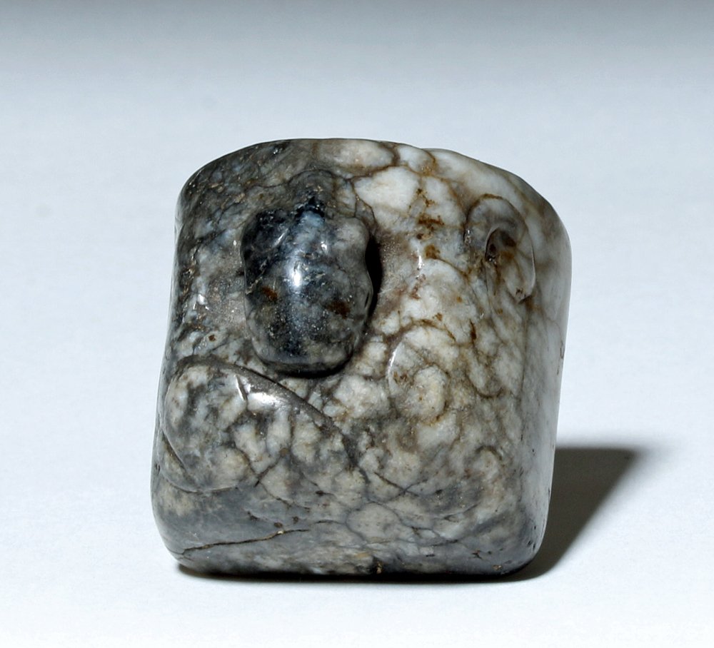 Chinese Ming Dynasty Jade Carving, Black and White: China, Ming Dynasty, 1368 to 1644 CE. This is a solid, square bell-shaped piece of black and white jadeite with a hole for suspension and swirling designs on each side. Size: 1.2" L x 1.2" W x 1.25" H