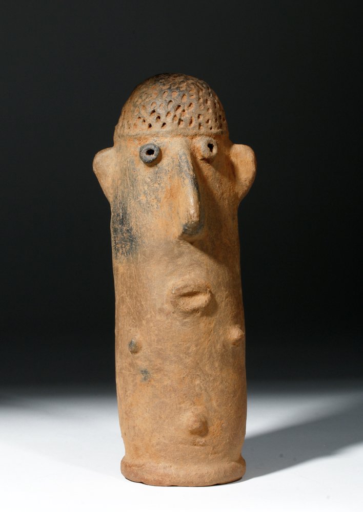 Ancient African Bura Clay Grave Marker, ex-Arnovick: Africa, Bura /Asinda / Sikka area, present day Niger and Burkina Faso, ca. 1000 to 1500 CE. This is a thick-walled, smooth terracotta cylindrical figure with three nubbins representing sexual organs,