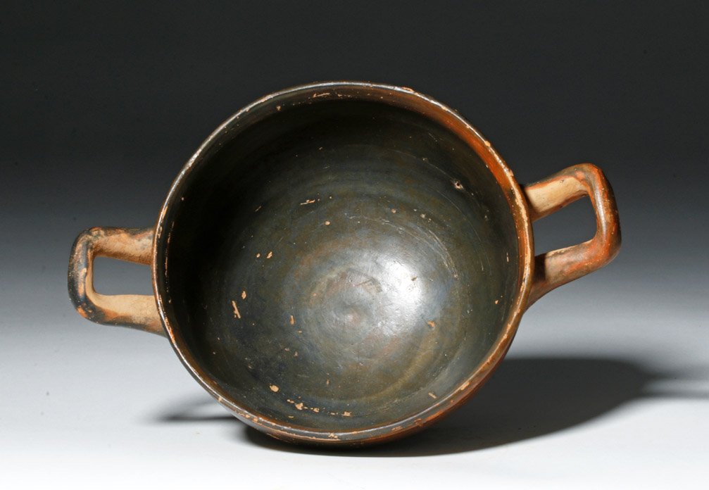 Greek Attic Blackware Kylix / Skyphos: Ancient Greece, Athens, ca. Late 6th / 5th Century BCE. A finely executed blackware kylix or perhaps skyphos with a wide and deep cup, standing upon a raised ring base, with twin horizontal handles on