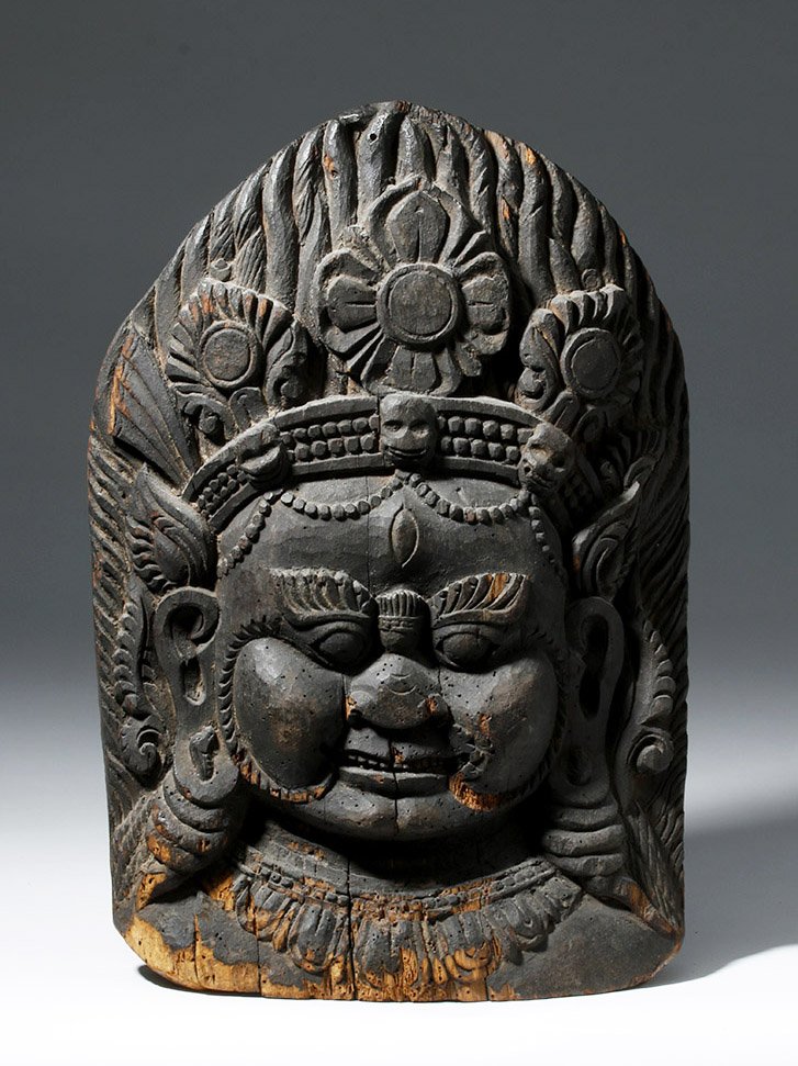 Museum-Exhibited 17th C. Indian Wood Relief of Kali: Central Asia, India, ca. 17th to 18th century CE. An intricately carved wooden relief sculpture depicting an unusual representation of Kali (or Devi) the Hindu goddess of death, time, and doomsday. Ka