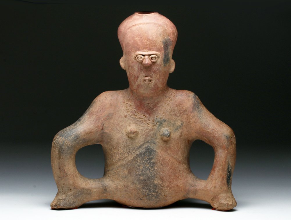 Pre-Columbian Pottery Figure of a Seated Woman: Pre-Columbian, West Mexico, probably Colima, ca. 300 BCE to 300 CE. Quite possibly the single most hideous pre-Columbian piece Bob has ever encountered. Facial features are beyond description and have