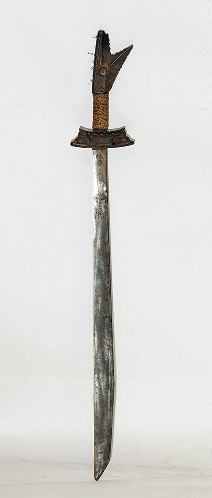 Large Decorated Indonesian Pedang Sword: Indonesia, 19th century CE. Very attractive Pedang sword with double edged blade and carved wooden grip and hilt. Very tribal in its appearance! Size: 43.5" L (110.5 cm) Provenance: Ex-Historia Antiqu
