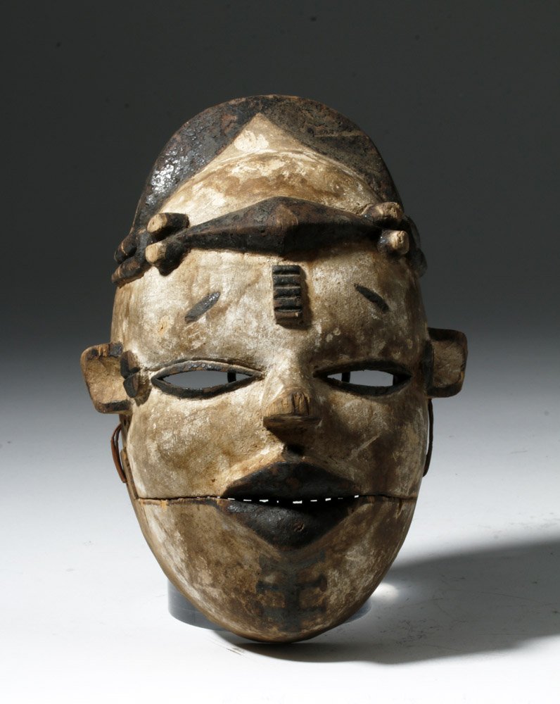 African Ogoni Elu Painted Face Mask, Hinged Jaw: Africa, Nigeria, Ogoni peoples, ca. early 20th century CE. This guy is really cool! Hand carved wood face (probably cane wood) with painted details: a kaolin white surface and dark lips, eye outlines,