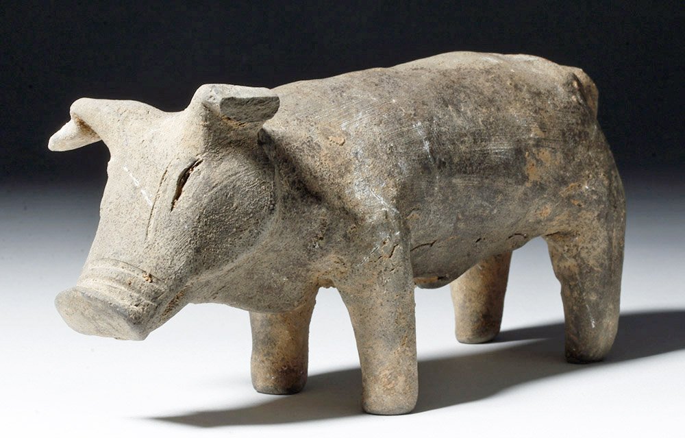 Chinese Han Dynasty Terracotta Pig: East Asia, China, Han Dynasty, ca. 206 BCE to 220 CE. A nicely modeled ancient pottery pig / wild boar standing squarely on all four hooves, with his head cast slightly downward, ears seemingly alert,