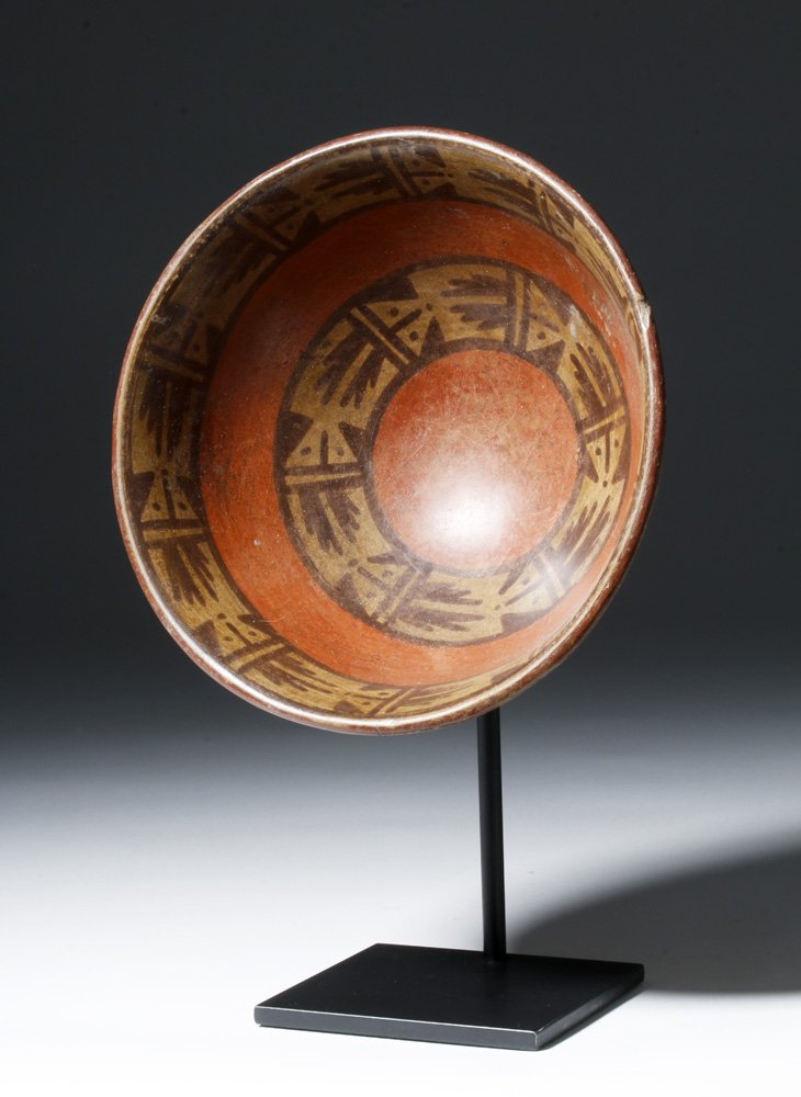 Lovely Narino Pottery Bowl w/ Abstract Bats: Pre-Columbian, South America, Colombia, Narino region, ca. 500 to 1000 CE. A beautiful, polychrome terracotta bowl of a generous breadth upon a raised foot, the interior walls decorated with two regis
