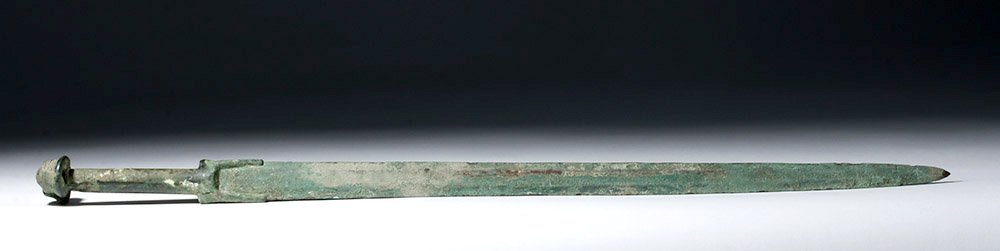 Luristan Bronze Sword w/ Open Pommel - 28.5"L: Luristan, ancient northwestern Iran, ca. 1200 to 800 BCE. Long sword cast in 2 pieces. Hilt with open flange, long rounded grip and distinctive hollow pommel once inset with inlays of bone or wood. Bl