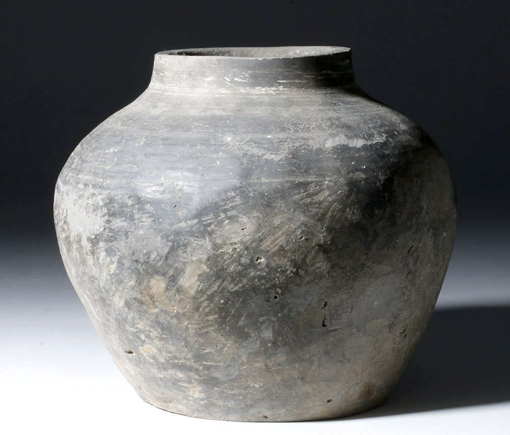 Chinese Warring States / Han Dynasty Greyware Jar: China, Warring States period to early Han Dynasty, ca. 400 BCE to 200 CE. This is a large, well-shaped grey ware pottery jar, with clear evidence for having been turned on a wheel, an inverse-piriform