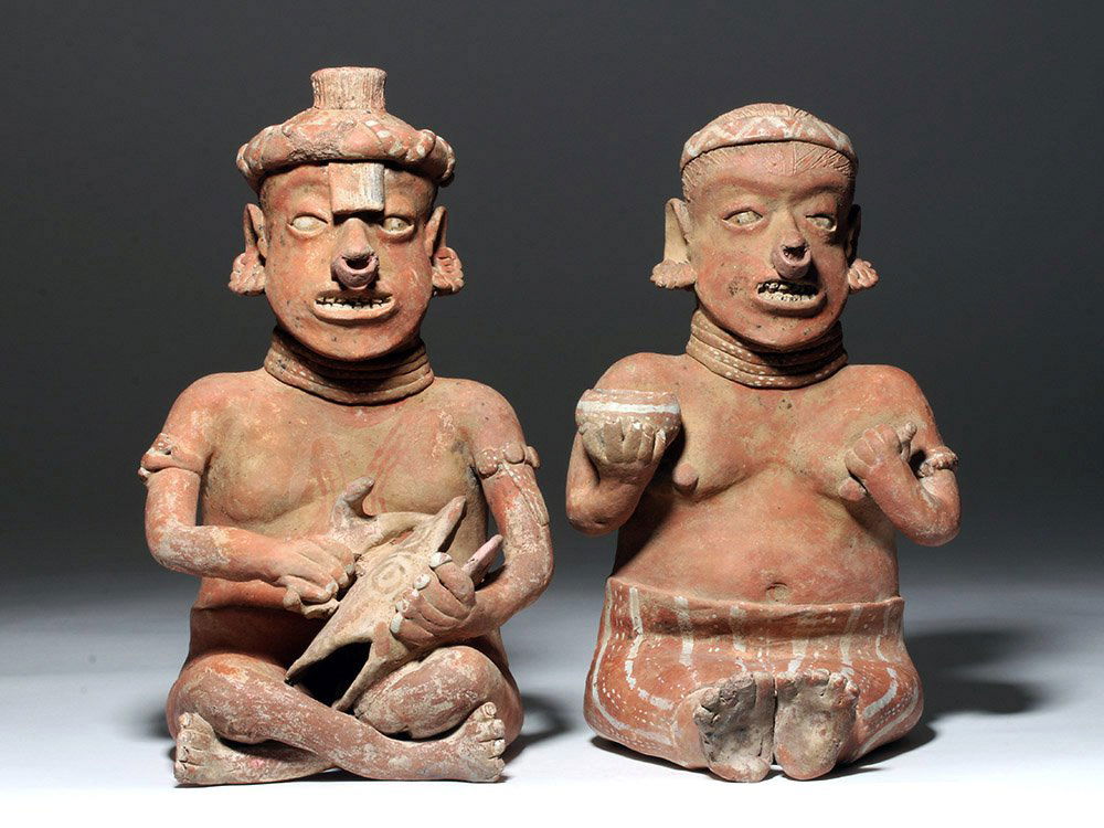Superb Nayarit Polychrome Male & Female Couple: Back at auction due to fraudulent bidder from 6/2/2016 sale… Pre-Columbian, West Mexico, Nayarit, ca. 300 BCE to 300 CE. A magnificent matched seated sculpted terracotta couple created by the ancie