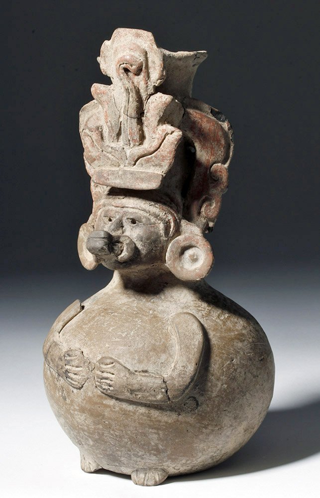 Rare Monte Alban Crema Paste Bottle - Seated Lord: Pre-Columbian, Oaxaca, Mexico, Zapotec culture, Monte Alban, ca. 100 BCE to 200 CE. This is an example of one of the famous forms of Monte Alban pottery, made from crema paste ceramics. These elaborat