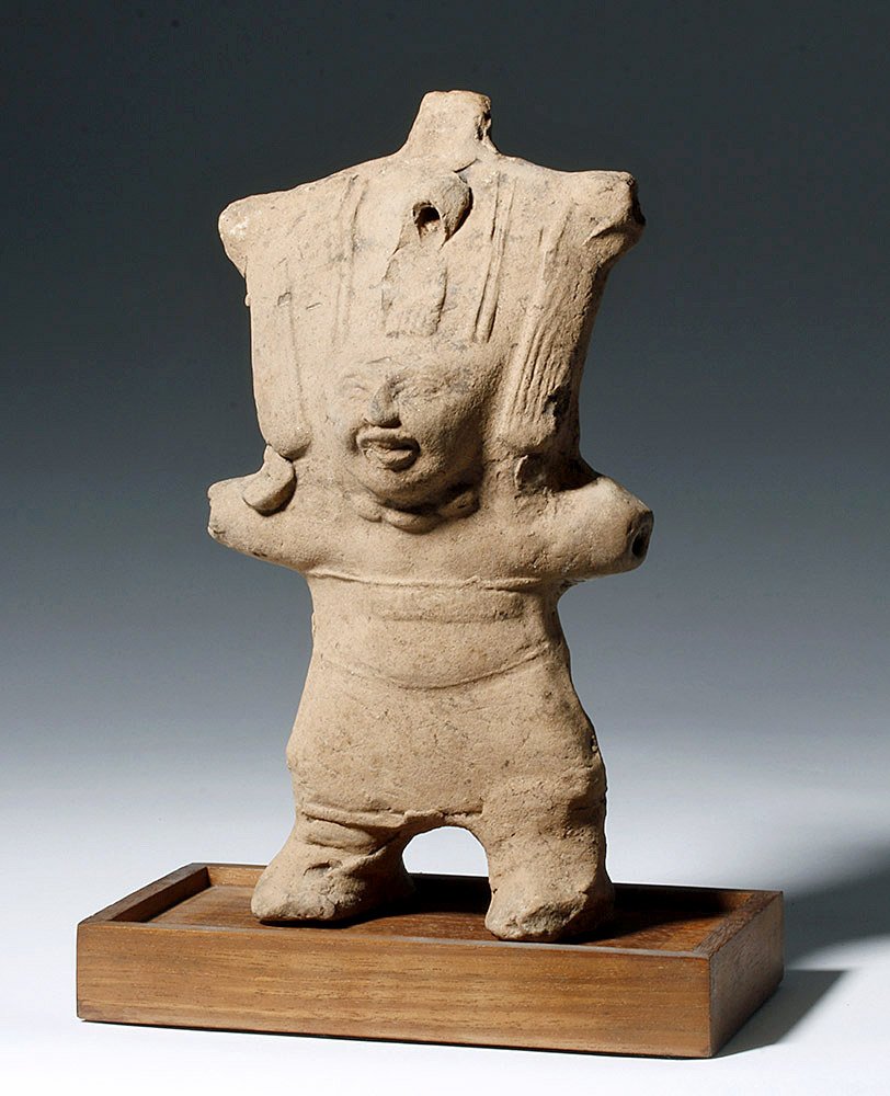 Veracruz Standing Sonriente Whistling Figure: Pre-Columbian, Mexico, Vera Cuz, ca. 100 BCE to 800 CE. This is a pottery standing "Sonriente" male figure from the Veracruz region of Gulf Coast Mexico. Like many hollow pieces of pottery from this r