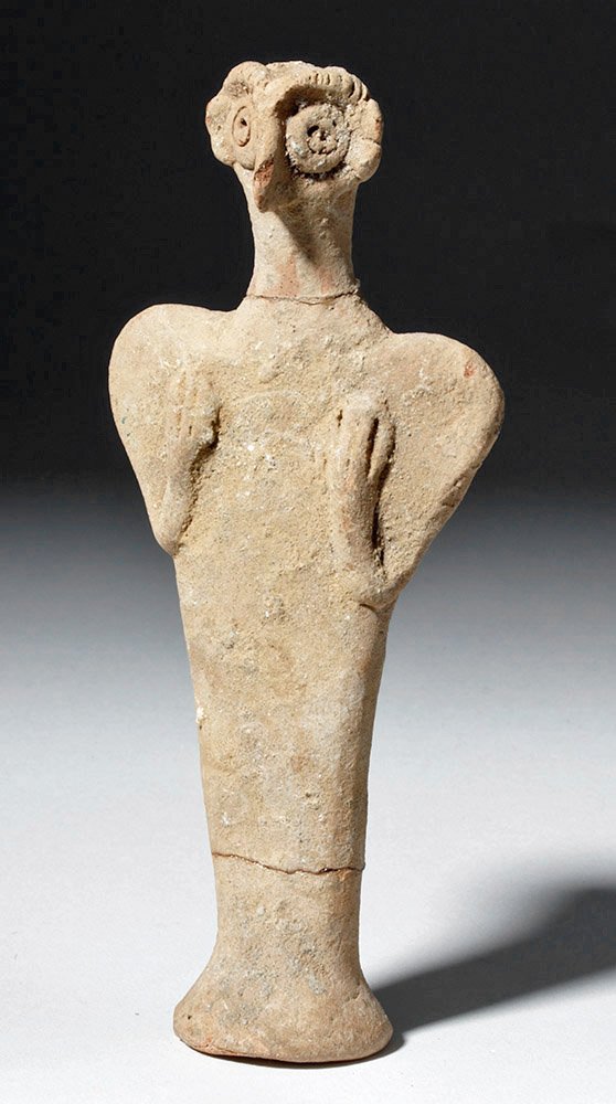 Syro-Hittite Clay Bird-Headed Astarte Figure: Ancient Near East, Syria, ca. 1500 to 1200 BCE. A terracotta female fertility figure with bird-like facial features including large round eyes and a pointed beak-like nose, hands placed over her chest