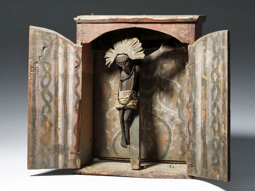 19th C. Guatemalan Niche w/ El Señor de Esquipulas: ** A portion of the proceeds from the sale of this lot will benefit The Fowler Museum at UCLA ** Central America, Guatemala, mid to late 19th century CE. A hand-built wooden latch-doored niche, painte