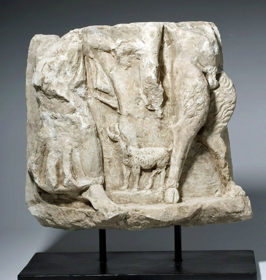 Roman Limestone Frieze - Fawn, Maiden, Goat: Rome, Eastern Empire, ca. 100 to 200 CE. Probably a bas-relief architectural frieze from a building, this carved limestone pieces depicts the lower halves of a woman and satyr's bodies; the woman is h