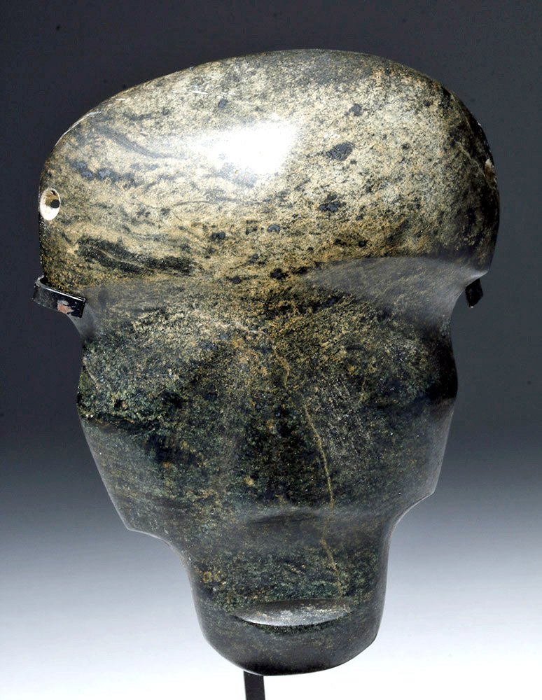 Mezcala Guerrero Serpentine Face Plate (Mask): Pre-Columbian, Guerrero, Mexico, Mezcala ca. 300 BCE. This is a serpentine greenstone face plate with a head shaped into an almost alien look -- enormous forehead, narrow chin, and flat, triangular no