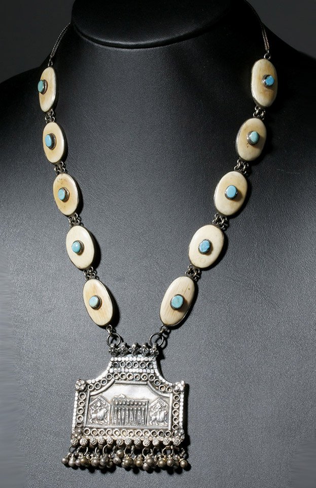 Antique Indian Silver, Bone & Turquoise Necklace: India or Nepal, ca. mid to late 19th century CE. A high grade silver antique necklace featuring a large temple-shaped amulet depicting the Eight Mothers (a group of Hindu goddesses including Brahmani,