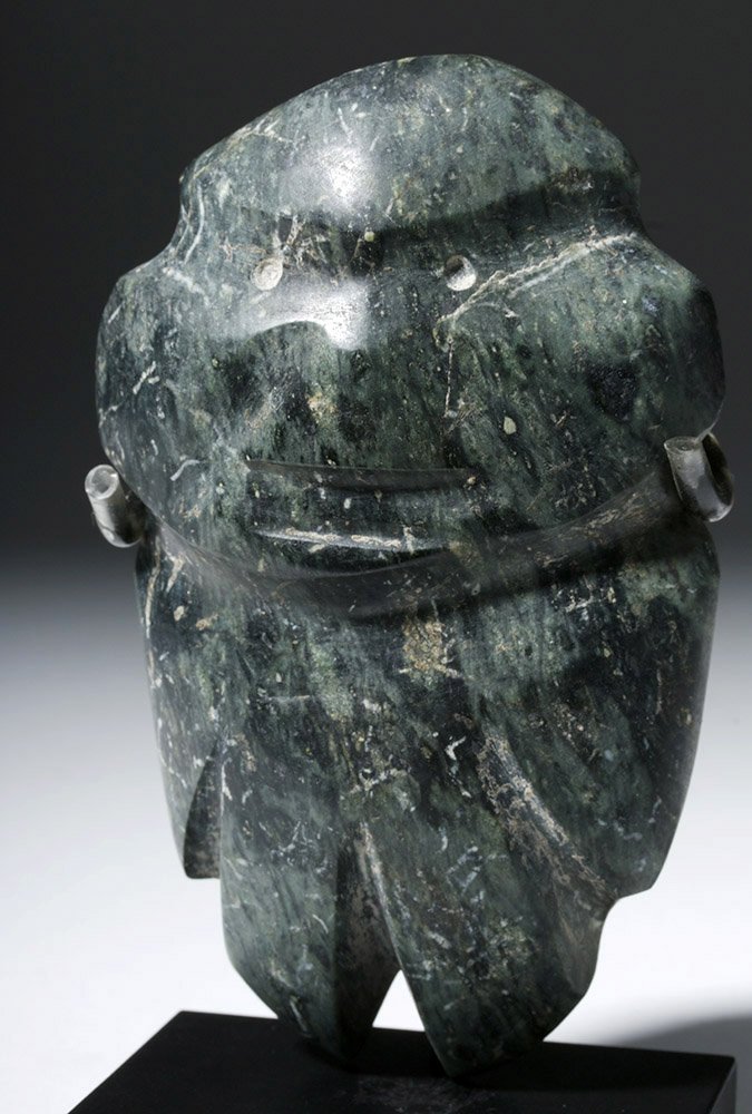 Guerrero Mezcala Banded Greenstone Figure: Pre-Columbian, Mexico, Guerrero Mezcala, ca. 300 to 100 BCE. Skillfully string-cut and finely carved from a banded greenstone of deep forest green hues with lighter green striations, this Mezcala stan