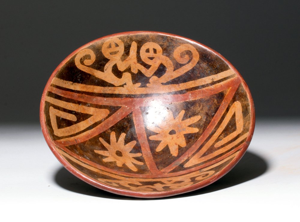 Narino Pottery Polychrome Monkey Bowl: Pre-Columbian, Colombia to Ecuador region, Narino Highlands, ca. 1250 CE. A beautiful polychrome pottery, deep walled flared bowl on a petite ring base, decorated with an attractive stylized geometric