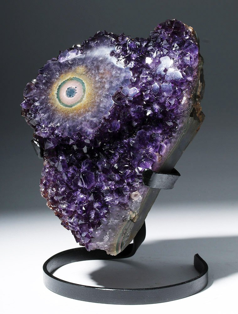 Stunning Amethyst Geode Section w/ "Eye": South America, Uruguay, millions and millions of years old. A section of amethyst (purple quartz) and white/clear quartz crystals from the interior lining of a large geode. A single polished stalactit