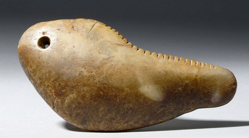 Rare Pre-Columbian Stone Musical Rasp: Pre-Columbian, probably West Coast of Mexico, ca. 300 BCE to 300 CE. The people of the shaft tomb cultures of West Mexico were highly musical, and this hand-carved stone rasp is great poor of that - w