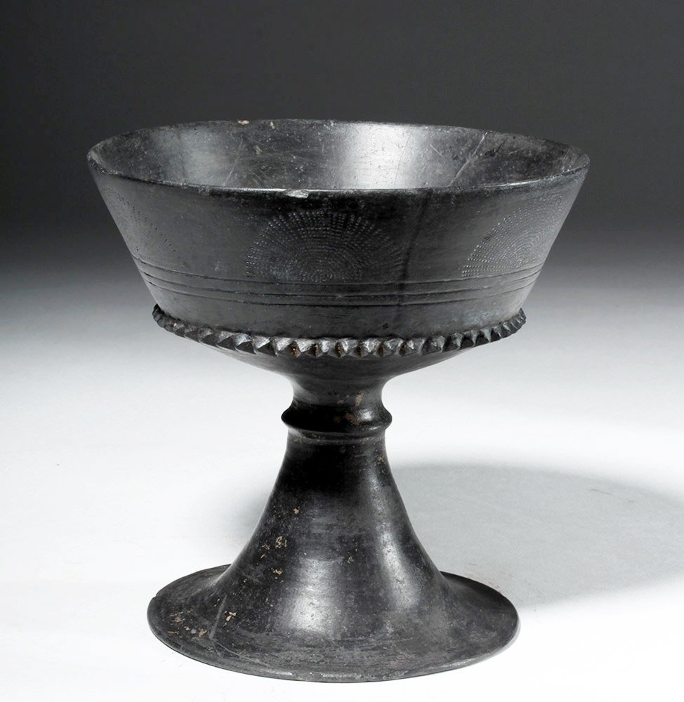 Large/Fine Etruscan Bucchero Chalice - Incised w/ Palms: Classical World, Etruria, ca. early 6th century CE. A stunning chalice with a slightly concave bowl and flaring, trumpet-shaped foot with a short, hollow stem. In the interior of the vase there is a d