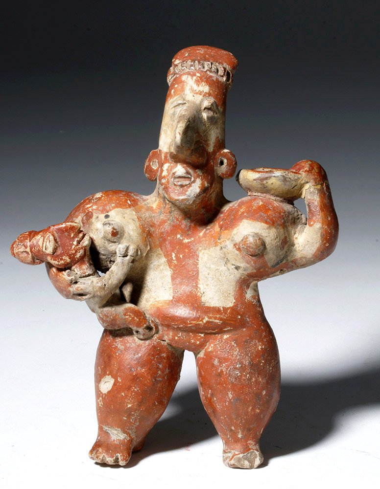 Jalisco Pottery Figure - Mother Holding Child: Pre-Columbian, Jalisco, Mexico, West Coast, ca. 300 BCE to 300 CE. Attractive pottery flat of a mother holding her child. Large legs and breasts placed awkwardly under her shoulders, child looking as 