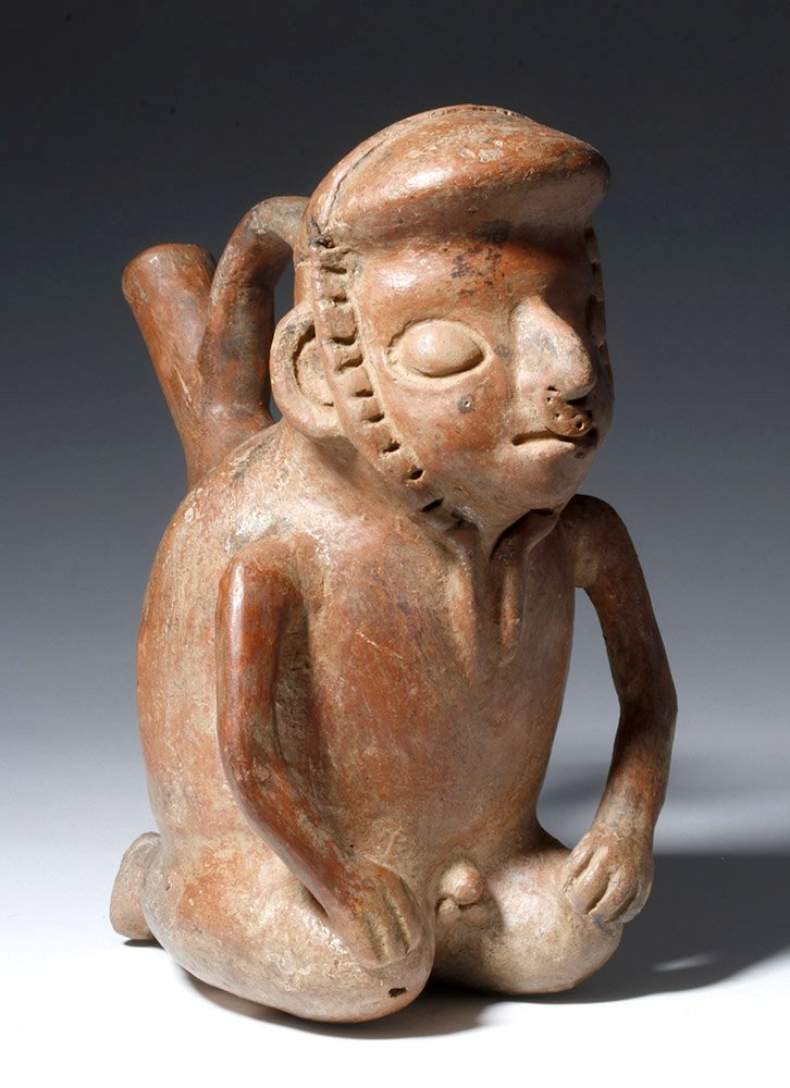 Vicus Figural Pottery Stirrup Vessel - Kneeling Male: Pre-Columbian, North Coast Peru, Vicus, ca. 200 BCE to 200 CE. A hollow, redware terracotta spouted stirrup vessel in the form of a kneeling man with both hands placed upon his knees. With the excepti