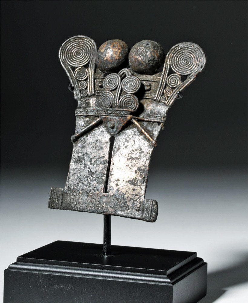 Large Tairona Zoomorphic Tumbaga Pendant: Pre-Columbian, Colombia, Tairona culture, ca. 1200 to 1500 CE. A beautiful tumbaga (alloy of gold and copper) ornament with a highly abstract zoomorphic design with tightly coiled swirling designs mad