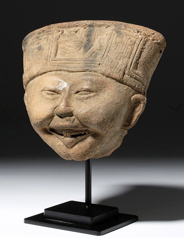 Very Fine Veracruz Terracotta Sonriente Head: Pre-Columbian, Vera Cruz, ca. 100 BCE to 800 CE. This is a hollow pottery "Sonriente" head from the Veracruz region of Gulf Coast Mexico. Sonrientes, or "smiling faces", are the most famous pottery fr