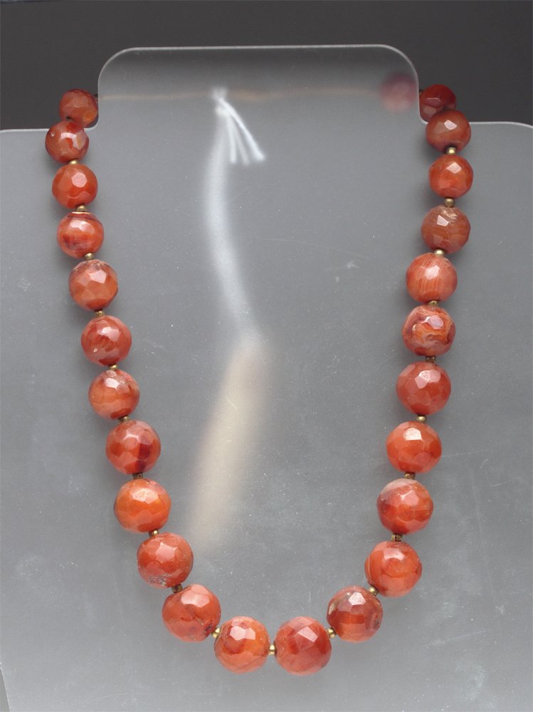 Ancient Persian Carnelian Necklace - Wearable!: Central Asia, probably Pakistan / Afghanistan, ca 800 to 1200 CE. Lovely necklace comprised of 25 multi-faceted carnelian beads with gold-tone spacers between. Restrung with barrel clasp. Size: 22.25"