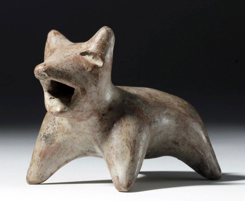 Cute Jalisco Redware Dog: Pre-Columbian, West Mexico, Jalisco, ca. 300 BCE to 300 CE. A cute, small, redware dog, depicted in a dynamic manner, with legs splayed, short tail curled up, perky ears, and mouth open in a bark. Sma