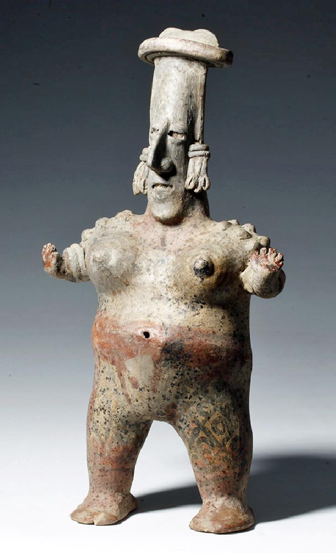 Jalisco San Juanito Standing Nude Female w/ Tattoos: Pre-Columbian, West Mexico, Jalisco, San Juanito, ca. 300 BCE to 300 CE. A standing female figure, nude except for a headband, long feather-like earrings, applied shoulder pellets, double armbands, an
