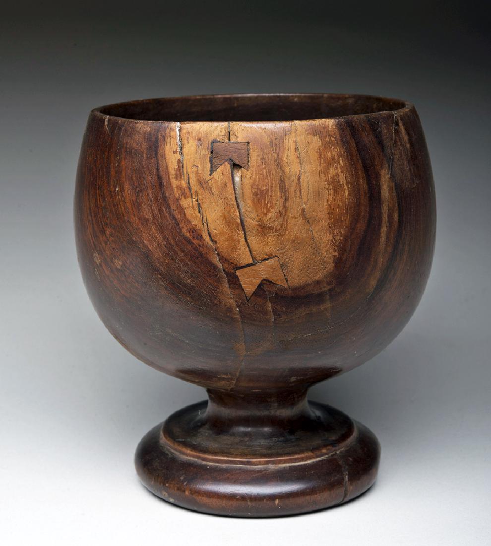 19th C. Hawaiian Wood Calabash w/ Foot: South Pacific, Hawaii, 19th century CE. A beautiful example of a wooden calabash - a serving bowl named for the gourd that it resembles, though it is made from inherently beautiful Hawaiian hardwood.