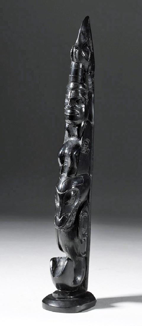 20th C. Haida Black Argillite Stone Totem Pole Figure: North America, Native American, Pacific Northwest, probably Haida people, ca. 20th century CE. A totem made of black argillite with an eagle atop a man atop a bird whose body ends in a whale tail. Arg