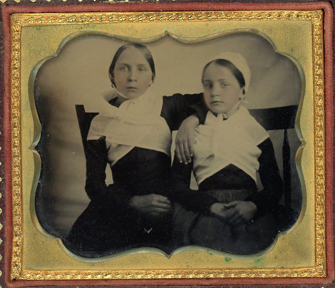 2 GIRLS SWATHED IN WHITE WEARING BONNETS (1 of 1)