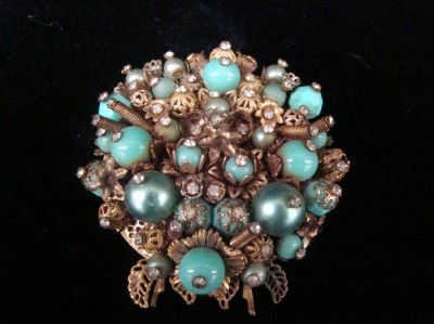 Early Miriam Haskell brooch: green stones goldtone-unsigned