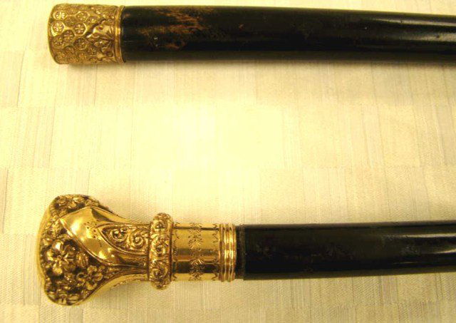 Lot of 2 Gold Plated Walking Canes: monogrammed , marked 26 d, signed McGregor, filigree gold tips Condition vg/g