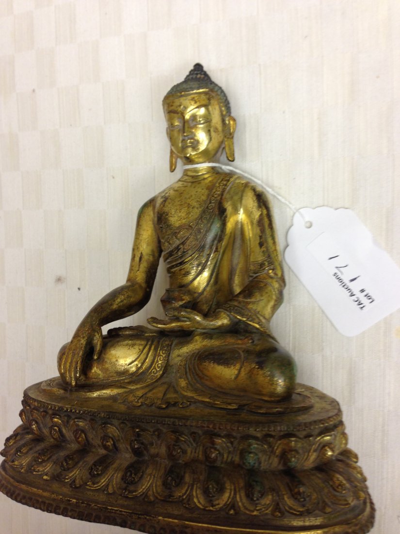 Gilt Bronze Sited Buddha: bronze Buddha, china, 19c. Buddha sitting cross-legged on a lotus throne, left hand to a small bowl, right hand placed on his right knee, smiling, detailed carving flower pattern on his cloth trim, an