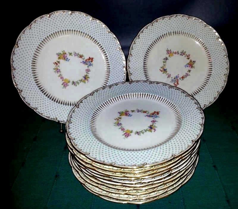 Set of 12 Minton Dinner Plates, Tiffany & Co: with decorated beading and floral design Condition line crack to one plate