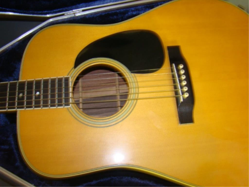 Martin & Co Guitar with Case Model D-35 Serial # 321419: inlaid guitar with original guitar paperwork and letter of provenance. Condition g , We just had some someone examine this item it has a crack line where the pick area is attached. Please see photo. N