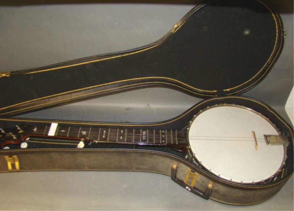 Vintage Vega? Banjo: vegalon weatherproof skin, 4/5 strings, mother of pearl inserts, carved neck, 10.75" diameter Condition needs strings
