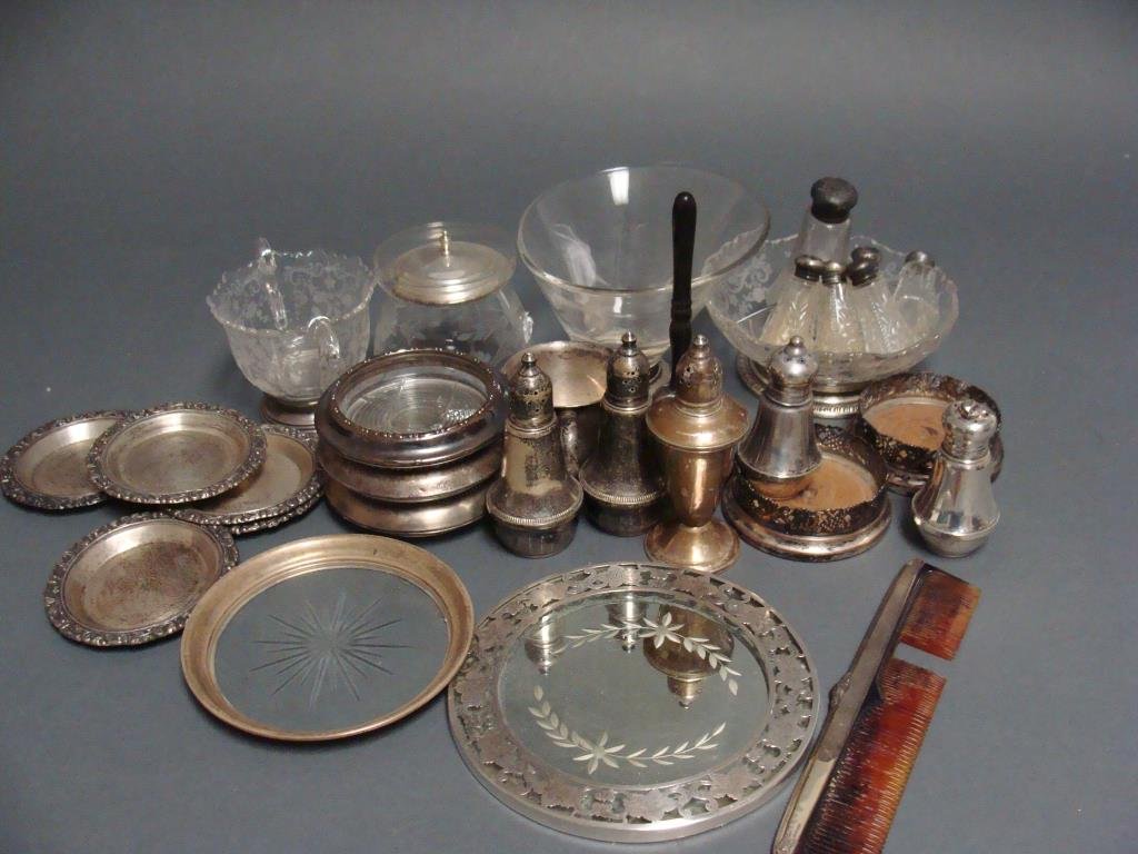 Assorted Vintage Lot of Sterling Silver and Crystal: A large vintage mixed lot of sterling items, including a baby cup, a bell, assorted coasters, trivets, a plateau, bowls, and shakers. Condition, g