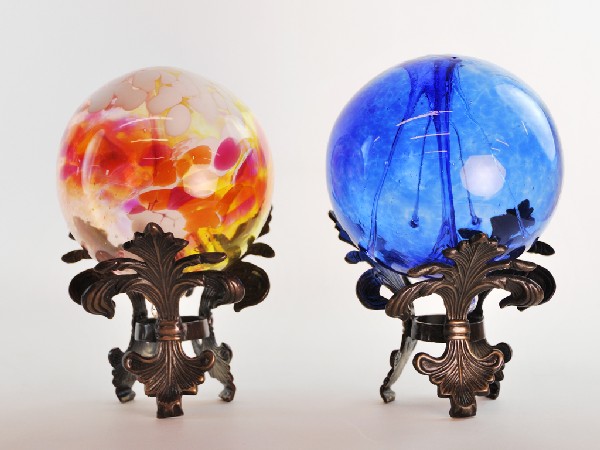 Pair of Hand Blown Glass Balls on Decorative Stands: Pair of Hand Blown Glass Balls on Decorative Stands Height 9 in; width 6 in; depth 6 in / Height 8 in; width 6 in; depth 6 in