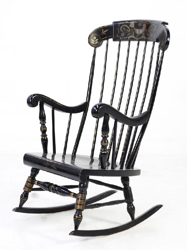 AN EBONIZED WINDSOR STYLE ROCKING CHAIR: AN EBONIZED WINDSOR STYLE ROCKING CHAIR with painted details 41 1/2 x 23 1/2 x 27 1/2 inches