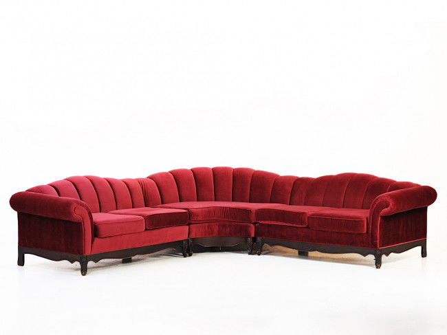A DEEP RED CORDUROY UPHOLSTERED THREE PIECE SECTIO: A DEEP RED CORDUROY UPHOLSTERED THREE PIECE SECTIONAL SOFA With camel backs and scrolled arms on carved ball and claw feet. 28 x 58 x 22 1/2 inches (end pieces) / 28 x 70 x 22 inches (mid section)
