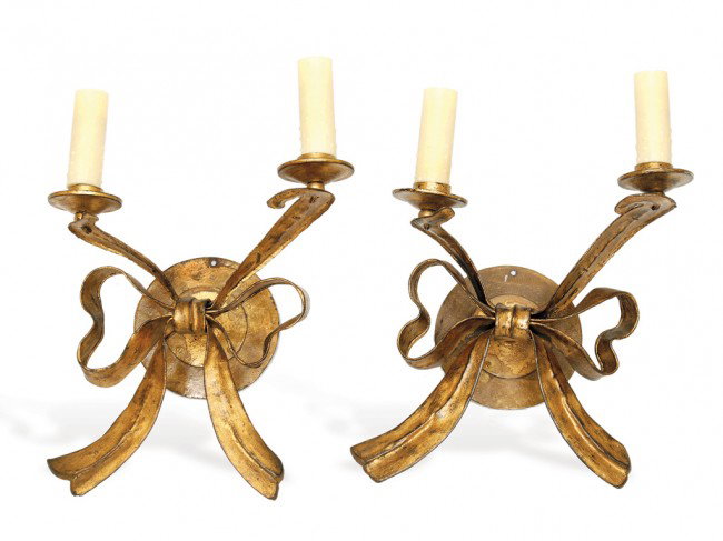 A PAIR OF RIBBON-SHAPED WALL CANDLE SCONCES By Art: A PAIR OF RIBBON-SHAPED WALL CANDLE SCONCES By Arturo Pani, Circa 1940 The classic Pani design, takes the form of a tufted ribbon, in steel and gold leaf, each holding a pair of candles. 16 1/2 inches