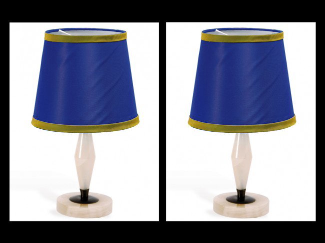 AN ALABASTER TABLE LAMP Circa 1950: AN ALABASTER TABLE LAMP Circa 1950 With blue shades rimmed in gold on round base. 14 1/2 inches