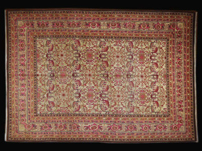 AN INDIAN AGRA RUG: AN INDIAN AGRA RUG 9ft 2 in x 12 ft 4 in