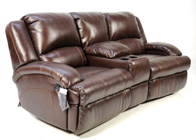 A THREE PIECE LEATHER THEATER SEATING SECTIONAL: A THREE PIECE LEATHER THEATER SEATING SECTIONAL with center console arm rest and holder 39 x 78 1/2 x 21 inches