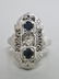 71: A LADIES 14K WHITE GOLD SAPPHIRE AND DIAMOND RING -