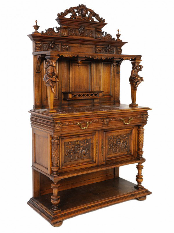 A HENRY II RED WALNUT RENAISSANCE REVIVAL INSPIRED: A HENRY II RED WALNUT RENAISSANCE REVIVAL INSPIRED MARBLE TOP DESSERT BUFFET France, late 19th Century featuring scrolling corbels, dragons, foliate draped shields and fully carved urn finials and aco